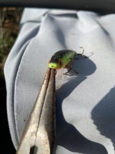 You can easily tune a fishing lure like this Rebel plug with a pair of pliers, and the same technique can be applied to many other plugs and crankbaits.